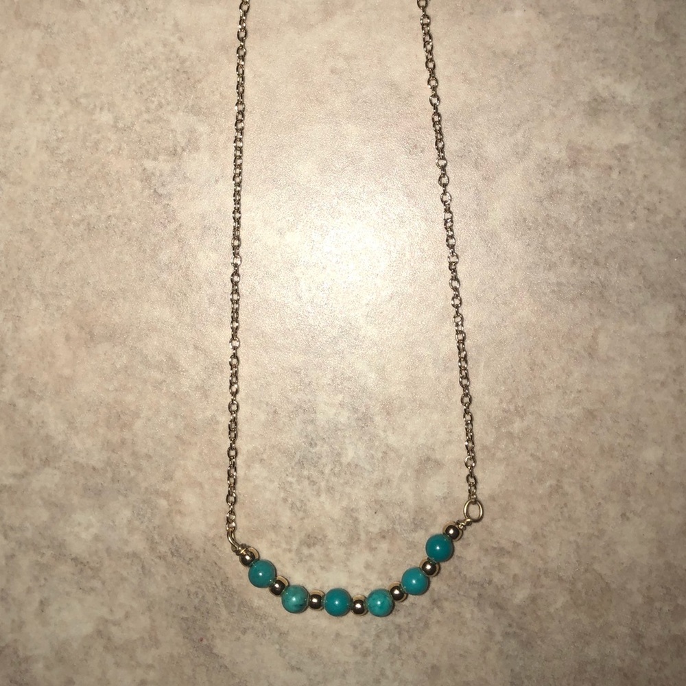 A super cute gold and turquoise beaded necklace!